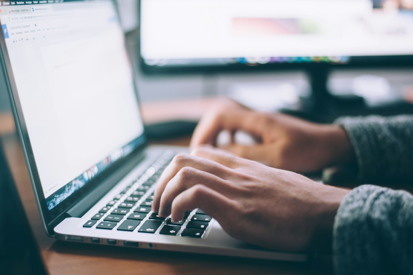 Person typing on a laptop, representing a login that still depends on a password